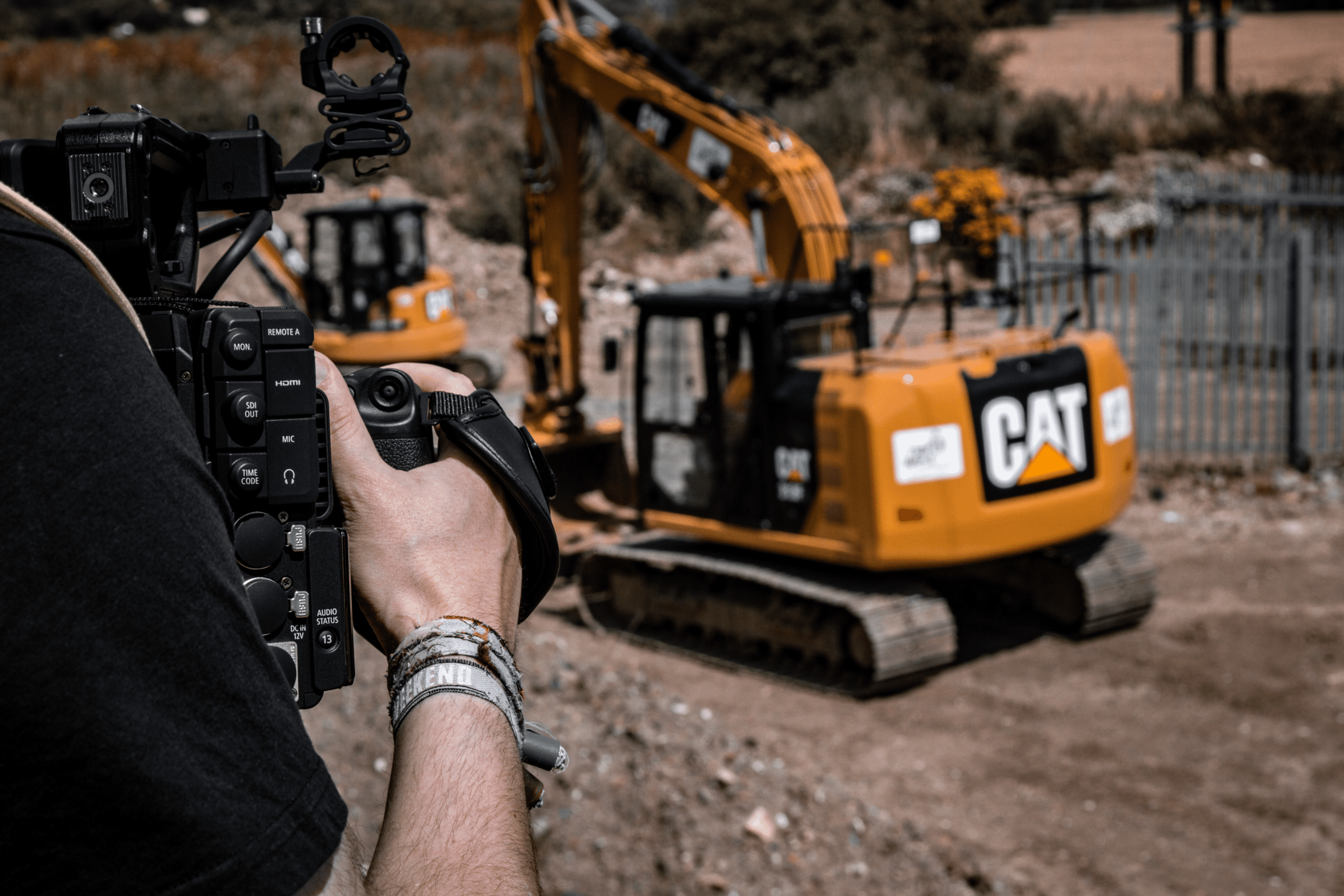 Production Staff Filming a Digger for Client Live Shoot
